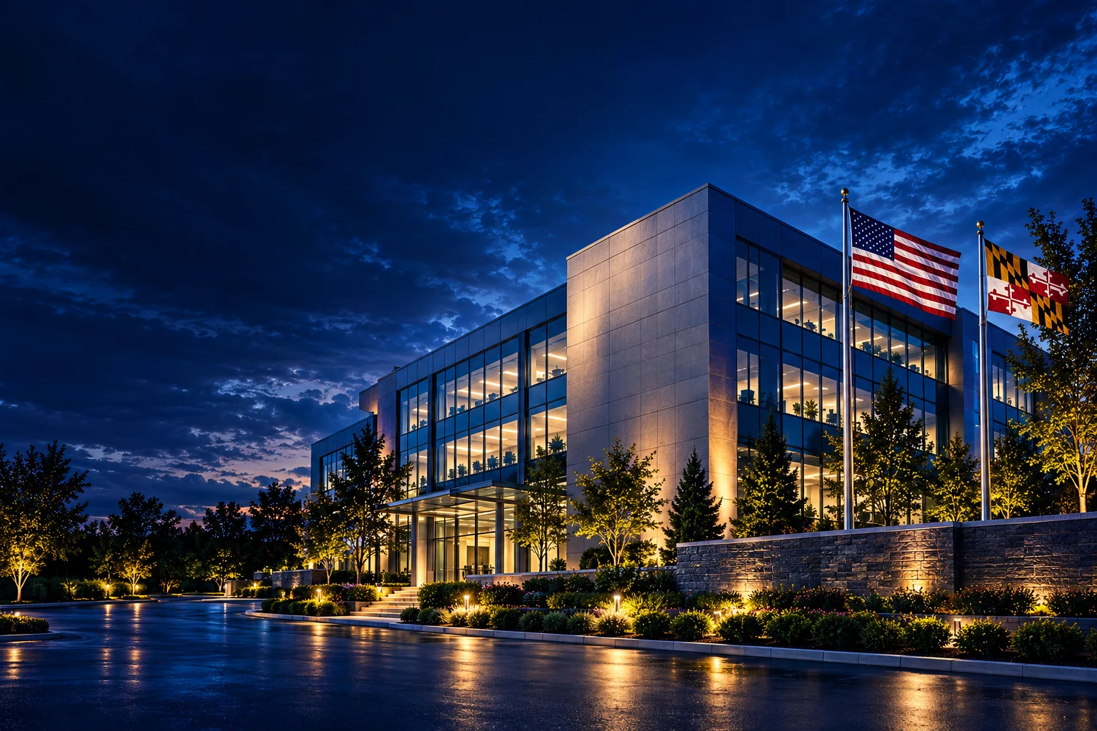 Braxton-Grant Technologies office building at dusk with the American and Maryland flags.